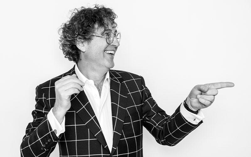 David Ben smiling and pointing